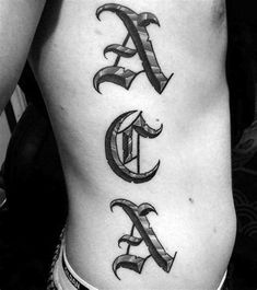 a man's lower back tattoo with the letter c and d on his ribs