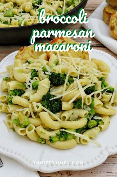 broccoli, parmesan and macaroni on a plate with bread