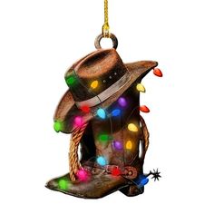 a christmas ornament with a cowboy hat and lights