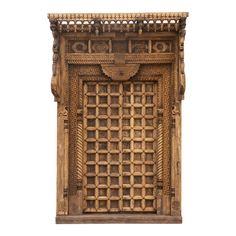 an intricately carved wooden window frame on a white background