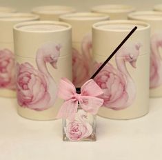 pink flamingos and peonies are painted on the side of this candle holder