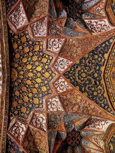 an intricately decorated ceiling in the middle of a building