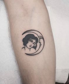 a woman's face in the moon tattoo on the left forearm and right arm