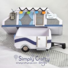 an origami model of a camper trailer