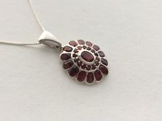 Metal Type: 925 Sterling Silver Gemstone(s): Genuine Garnet Stone Origin: Africa Shapes & Sizes: 6x4mm oval (1 pc) 5x3mm Faceted oval (14 pcs) 1.5mm Round (16 pcs) Total Item Weight: 8.01 grams Pendant including bail approx. 1 3/8 L x 3/4 W inch Necklace: 18 inches Sterling Silver Box Chain new condition Garnet Stone, Silver Box, Wedding Jewellery Necklace, Sterling Silver Necklace Pendants, Silver Pendant Necklace, Box Chain, Wedding Necklace, Sterling Silver Pendant, Sterling Silver Pendants