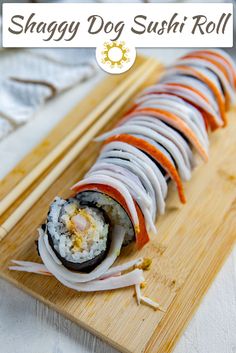 sushi roll on a cutting board with chopsticks