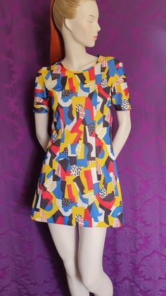 Art collage print homesewn micro minidress. Mary Quant & Matisse inspired design. Bold colours and pattern make this an incredibly unique piece - made by someone decades ago - hopefully for a fun occasion. Simple and eye-catching and so very short!  Fairly sturdy polyester gives it body despite the simple shape.  Measures:  Bust 35 inches Waist 29 inches Hips 40 inches Length shoulder to hem 32 inches Colour Collage, Matisse Inspired, Mary Quant, Color Collage, Print Collage, Art Collage, Dress Clothes For Women, Bold Colors, Primary Colors