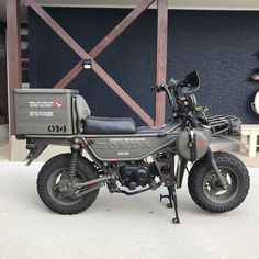 a motorcycle parked in front of a garage