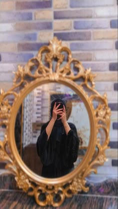 a woman taking a selfie in front of a mirror