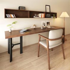 a desk with a chair, lamp and bookshelf in the corner next to it