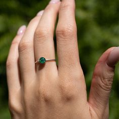 Delicate green ring with tiny Malachite stone pieces captured in glass like resin in a 5mm round shape. Bright natural green ring is a perfect compliment to your everyday style. Beautiful by itself or in a stack. Every piece is hand made in our studio and always unique. Metal: 14k gold filled. Style: Round 5mm on a 1mm thick band. Size: Available in many sizes ready to ship. If you would like your ring made in a custom size feel free to reach out. Round Garnet Ring, Abalone Ring, Pyrite Stone, Malachite Ring, Galaxy Ring, Green Ring, Malachite Rings, Tiny Rings, Green Rings