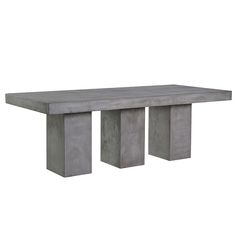 a concrete table sitting on top of a white floor next to two cement pillars with one end missing