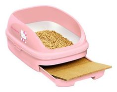 a pink litter box with a cat in it