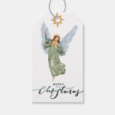 a christmas gift tag with an angel holding a star and the words merry christmas on it