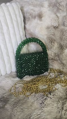 100% Handmade beaded bag for special occasion  Luxury shiny beads Exclusive design The purse is handmade with care and attention to detail, ensuring that each one is unique. Size: 7.5in*9in*3in. Color is dark green You can carry all necessary essentials and look very elegant. There is magnetic snap closure for easy access You will receive a dust bag and stylish gift box.  I believe you will collect the gorgeous memories with this luxury bag. Feel free to contact me for any question or special cu Evening Green Clutch Mobile Phone Bag, Trendy Handheld Beaded Evening Bag, Beaded Clutch Shoulder Bag As Gift, Beaded Clutch Shoulder Bag For Gifts, Beaded Shoulder Bag Clutch, Trendy Beaded Evening Bag As Gift, Handheld Shoulder Bag With Rhinestones As Gift, Trendy Beaded Evening Bag Perfect As A Gift, Green Crossbody Clutch As Gift