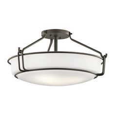 a semi flush ceiling light with frosted glass shades on the bottom and black metal frame