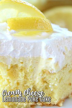 a piece of cake with white frosting and lemon on top