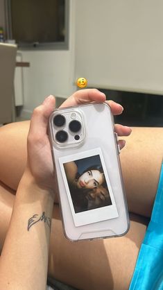 a person holding an iphone case with a photo on it