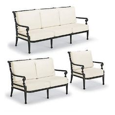 three black and white couches sitting next to each other