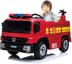 a small child in a toy fire truck