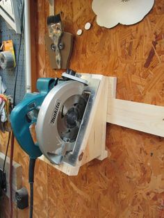 a circular saw sits on top of a piece of wood