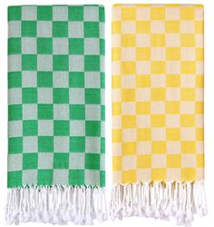 two green and yellow checkered towels with tassels on each side, one in the same color