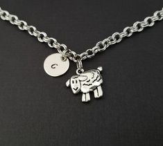 Personalized Antique Silver Sheep Bracelet!  A detailed sheep charm on a lovely chain bracelet makes the perfect gift for you or your best friend.The sheep bracelet charm is made from zinc alloy and measures 18 mm by 16 mm.  The bracelet is high quality zinc alloy and measures 8.5".  The sheep bracelet can be personalized with a .5" silver plated disc stamped with the initial of your choice.  The charm and initial disc are connected to the bracelet with sturdy split rings that will never fall of Guardian Angel Gifts, Football Bracelet, Bracelet Initial, French Hook Earrings, Personalized Bracelet, Ball Bracelet, Split Rings, The Sheep, Bff Gifts