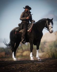 a man riding on the back of a black horse