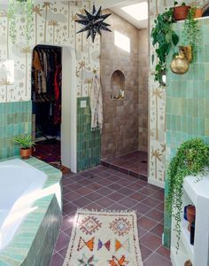 a bath room with a rug a sink and a mirror on the wall next to a tub