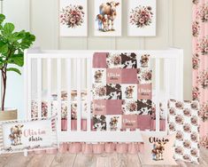 a baby crib bedding set with pink and brown flowers on it, next to two framed pictures