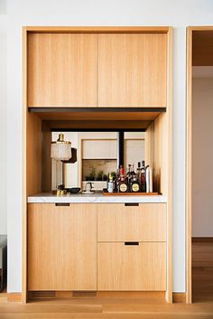 a kitchen with wooden cabinets and white counter tops