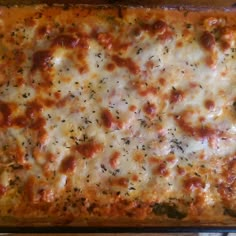 a casserole dish with cheese and meat on it, ready to be eaten