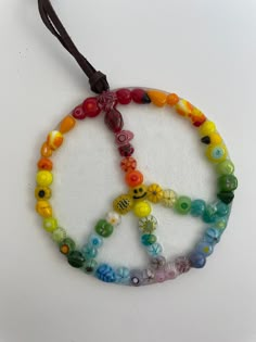 a peace sign made out of glass beads