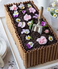 a cake decorated with flowers on top of a white plate