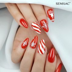 Celebrate the holiday season with these bold red nails, featuring intricate white snowflakes, candy cane stripes, and a cute reindeer design. A perfect mix of festive cheer and elegance for Christmas! #ChristmasNails #HolidayNailArt #RedAndWhiteNails #CandyCaneNails #SnowflakeNailDesign #FestiveNailInspo #WinterNailIdeas #ReindeerNails #ElegantHolidayNails #SeasonalNailArt Design On Red Nails, Nail Art Ideas Christmas, Art Ideas Christmas, Nail Designs For 2023, Snowflake Nail Design, Christmas Nail Art Ideas, Red And White Nails, Christmas Nail Ideas, Fancy Nail Art