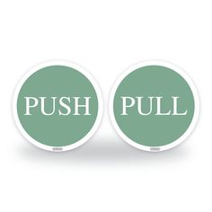 two green push buttons with the words push pull on them