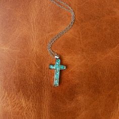 Express your faith with this dainty, beautiful necklace. Our GENUINE STONE CROSS NECKLACE is simple, yet powerful. Designed with one-of-a-kind durable 316L Stainless Steel crushed Turquoise. Perfect for everyday wear and other special occasions. ABOUT THIS PRODUCT Material: 316L Stainless Steel Stone Options: Genuine TurquoiseColor*/Finish: Silver Size: 16” Chain + 2" Extender Pendant Size: 1.22 inches x 0.67 inches Girlfriend Friendship, Western Fits, Stone Cross, Stainless Steel Cross Pendant, Cross Necklaces, Antler Ring, Steel Cross, Engagement Sets, Sparkly Things