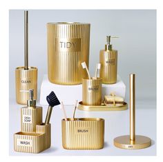 gold bathroom accessories on display in front of a white background with the words diy written across it