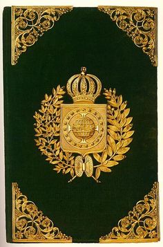 a green book with gold trimming and a crown on it