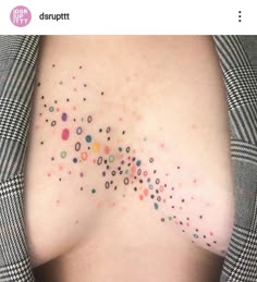 a woman's breast with dots on it