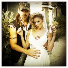 a man and woman dressed up in wedding attire