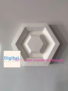 an image of a white hexagonal object on the wall