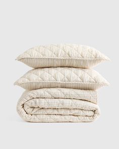 four pillows stacked on top of each other