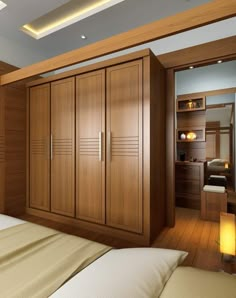 a bedroom with wooden cabinets and white sheets