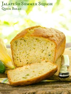 a loaf of bread sitting on top of a table next to a knife and pepper