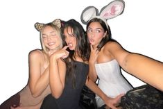 three women in bunny ears posing for a photo