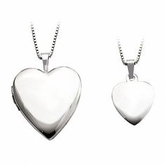 Like mother, like daughter. This delightful locket and pendant set makes a thoughtful gift for both. Fashioned in sleek sterling silver, Mom's heart-shaped locket features a polished finish and opens to reveal space for a small photo or memento. This locket suspends along an 18.0-inch box chain that secures with a box clasp. A darling complement to Mom's look, the daughter's heart-shaped pendant suspends along a 14.0-inch box chain that secures with a box clasp. Buffed to a brilliant luster, thi Mother Daughter Necklaces, Necklaces Heart, Mother Daughter Necklace, Daughter Necklace, Locket Charms, Feather Pendant, Silver Jewelry Rings, Mother And Daughter, Heart Locket