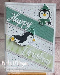 a christmas card with a penguin on it