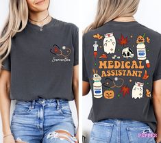 a woman wearing a t - shirt that says medical assistant on the front and back