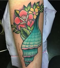 a vase with flowers in it on the arm